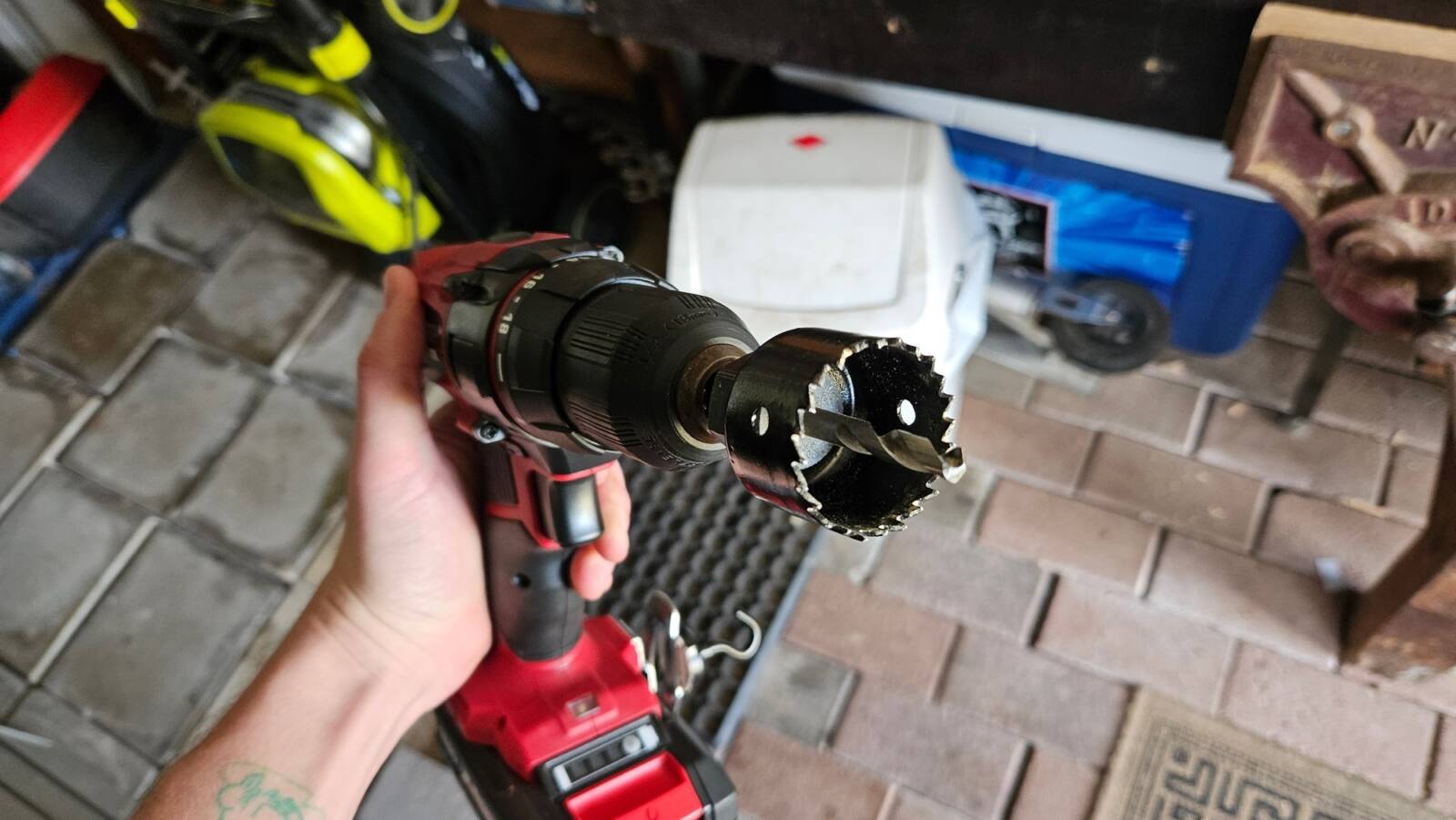My cordless drill with a hole saw attached.