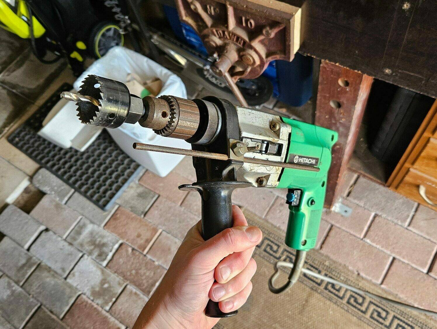 My big hitachi plug-in hammer drill with a hole saw attached.