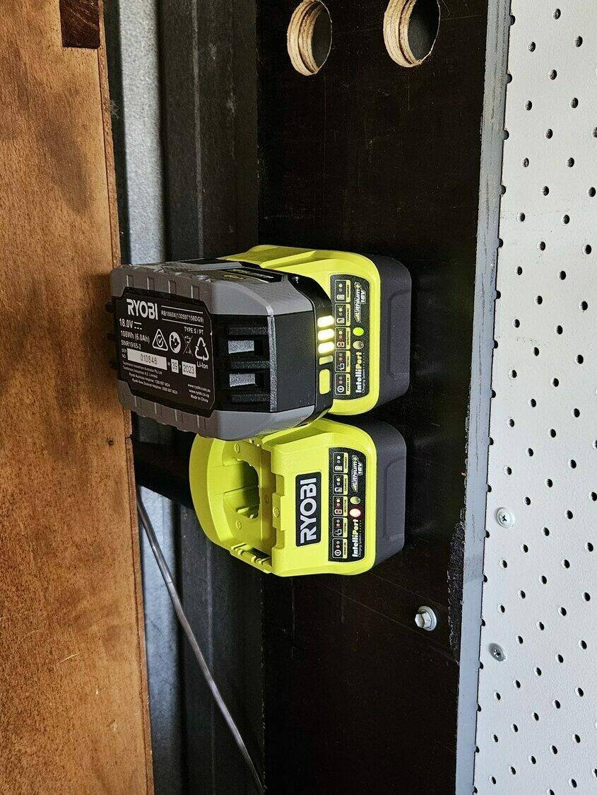 A battery charging in one of the mounted chargers.